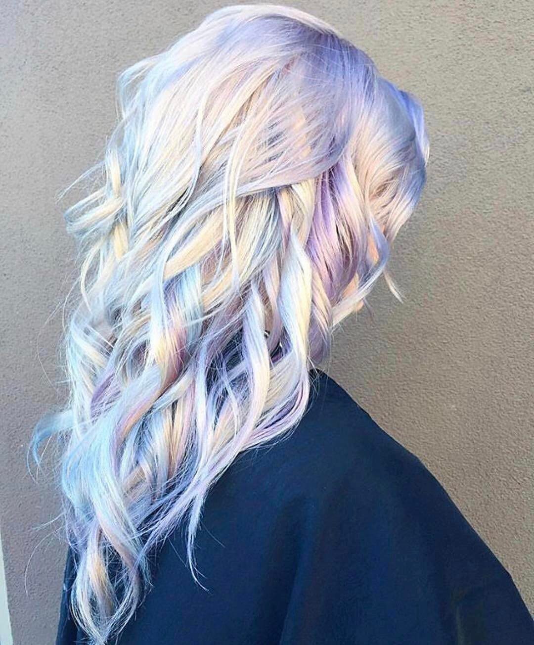 Long wavy ash blonde hair with iridescent lavender, blue, and pink tones