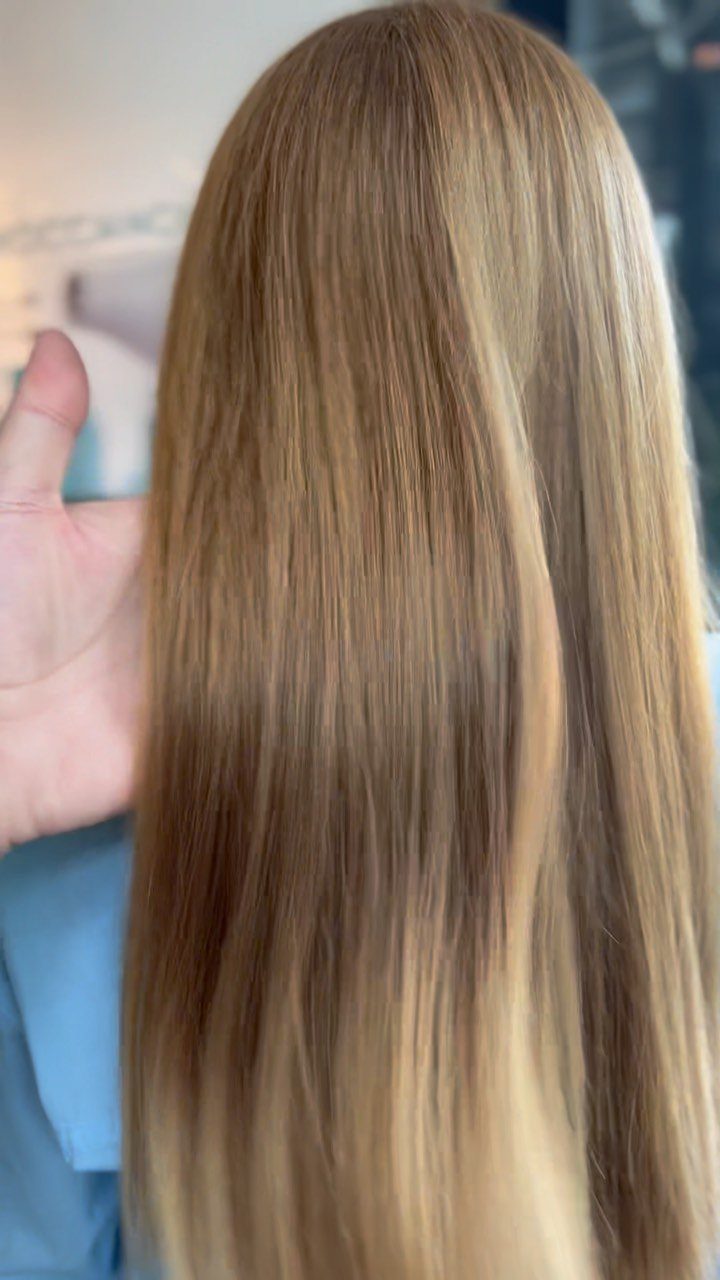 Long straight golden ash blonde hair with cool brown and blonde tones