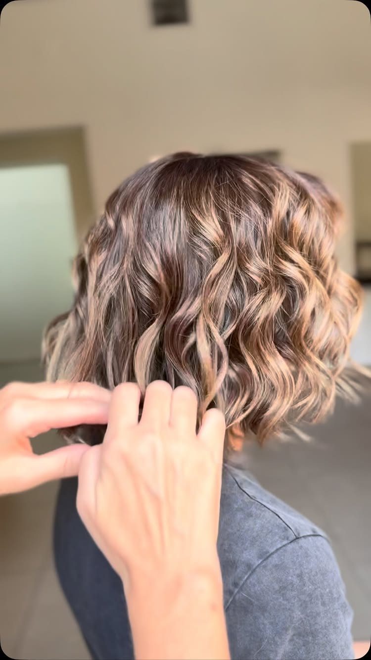 Wavy beige blonde bob with dimensional warm and cool highlights