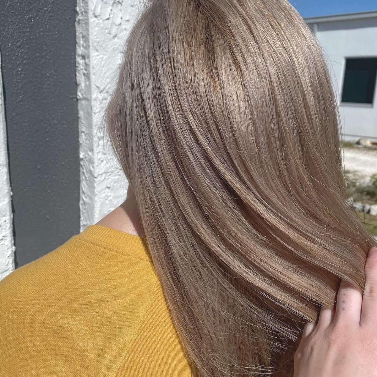 Long mushroom blonde hair with cool ash-brown and sandy blonde tones