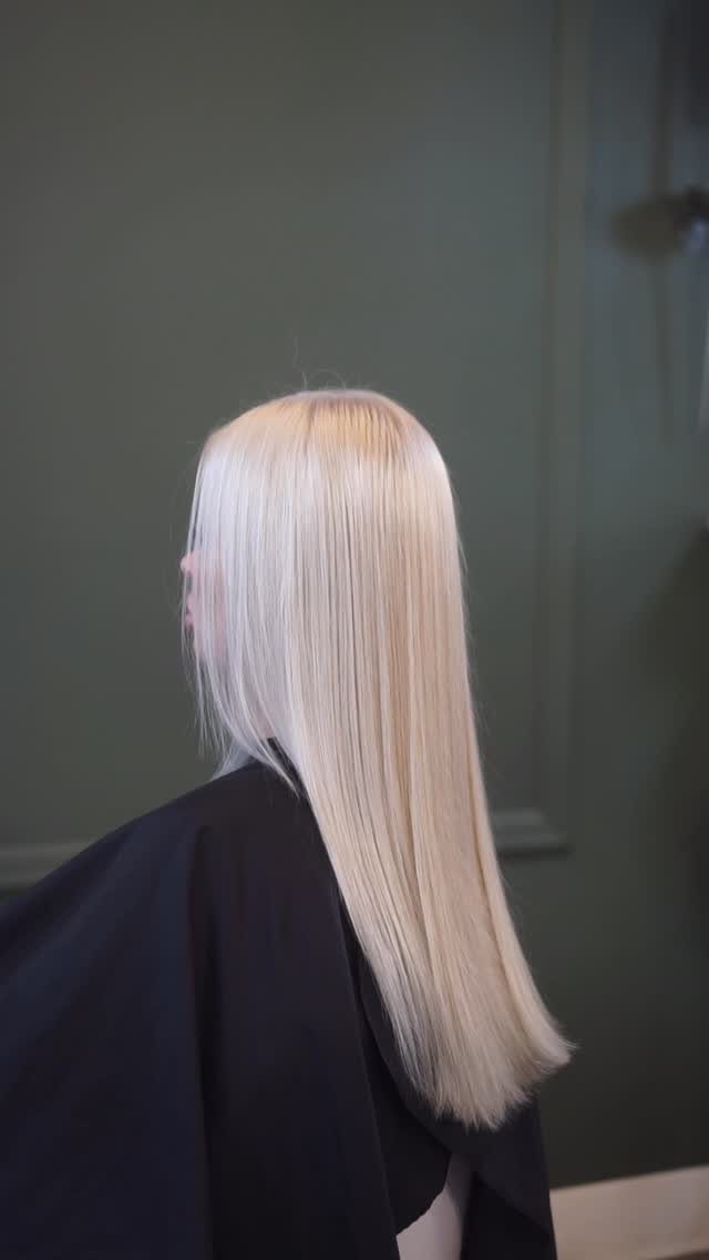 Straight platinum blonde hair with a cool, silvery finish