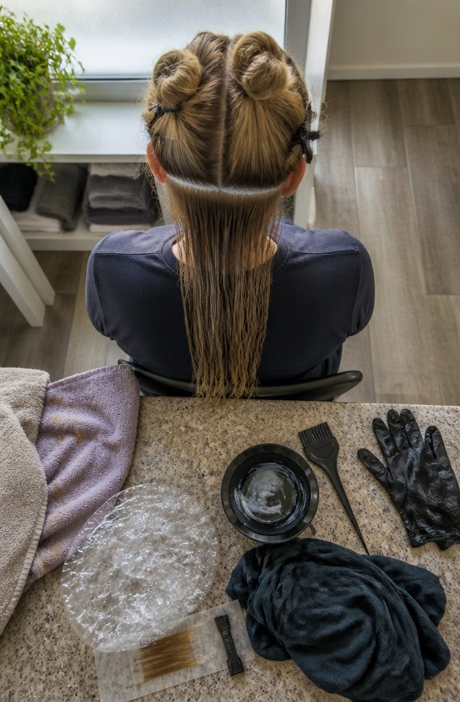 Blonde hair pictured with hair coloring preparation