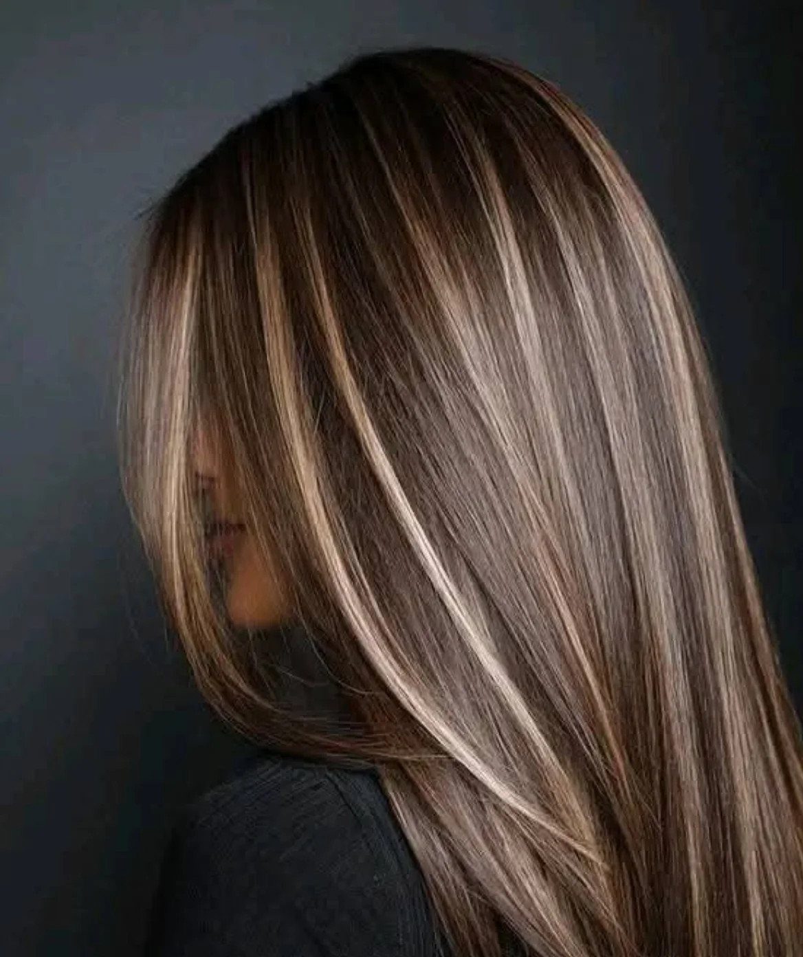 Long dark brown hair with fine caramel and blonde highlights