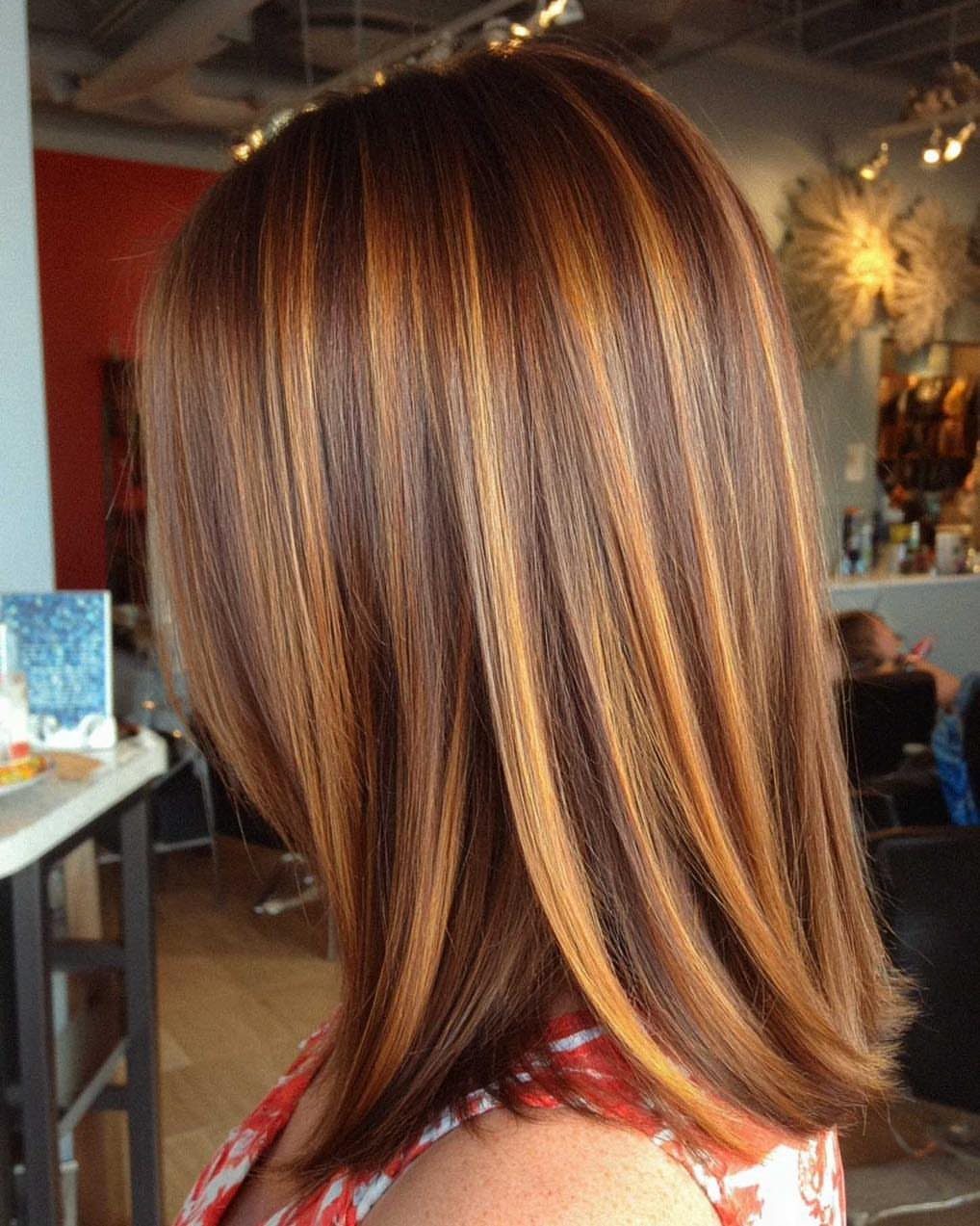 Long brown hair with fine golden blonde ribbons and darker roots