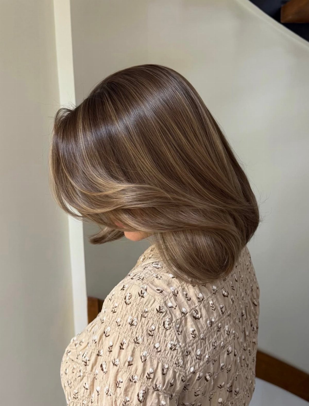 Shoulder-length brown hair with smoothly blended honey midlights