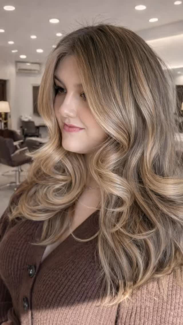 Woman with long blonde curls showing fine, subtle highlights throughout
