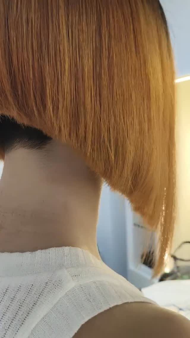 Straight light brown angled bob with a longer front section